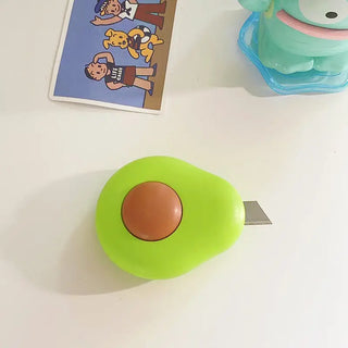 Avocado mini cutter close-up showing retractable blade extended