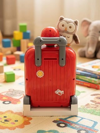 Rear view of red suitcase-style Spider-Man money bank showing handle and wheels
