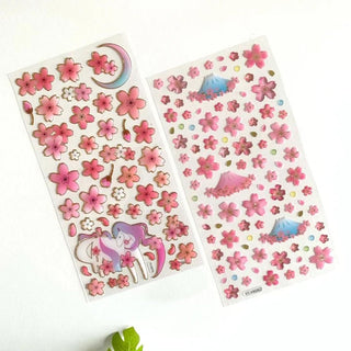 Sakura sticker sheets with unicorn and moon kawaii motifs